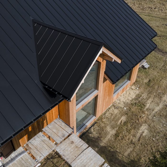 high-angle-beautiful-wooden-house-with-new-roof