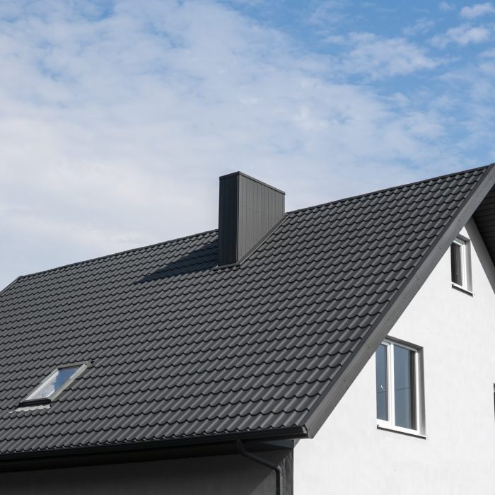 Modern roof covered with tile effect PVC coated brown metal roof sheets